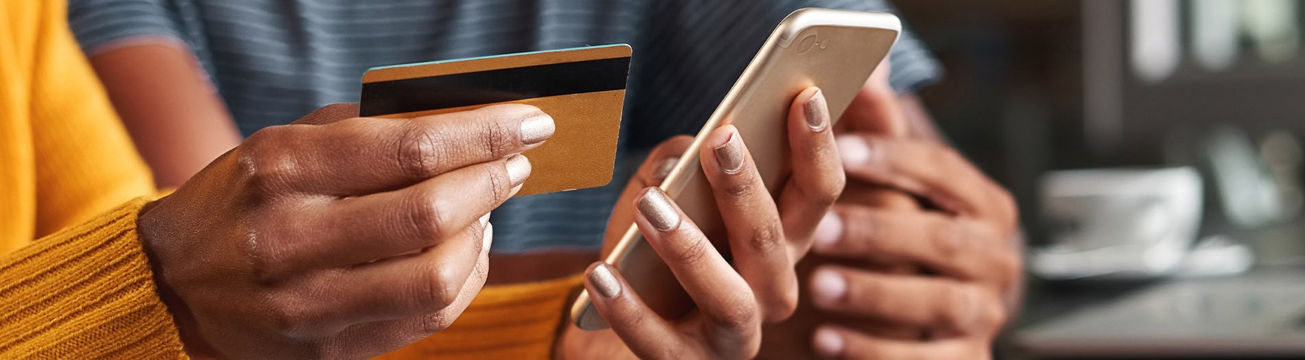 gold debit card and mobile device